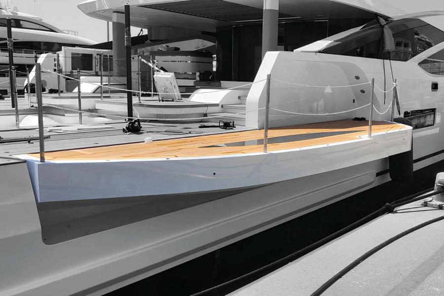 Fold-out wings made of aluminium alloy with kinematics to assure fluid and safe movements during opening and closing, installed on the side of a luxury yacht